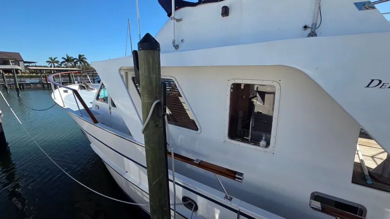 Slide: The Image of DeFever 48 Tri Cabin yacht from 1987 docked. - 19