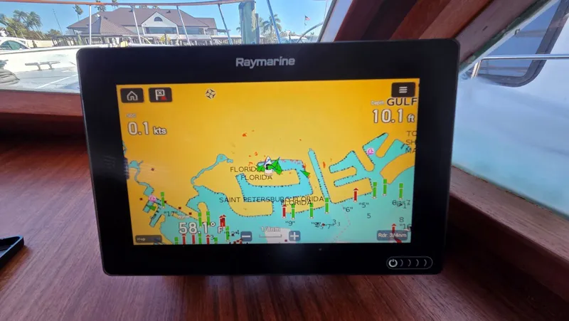 Slide: The Image of Raymarine navigation system on DeFever 48 Tri Cabin, displaying Florida map. - 38