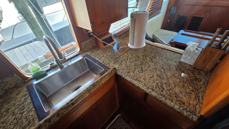 Slide: The Image of Kitchen area of 1987 DeFever 48 Tri Cabin yacht. - 48