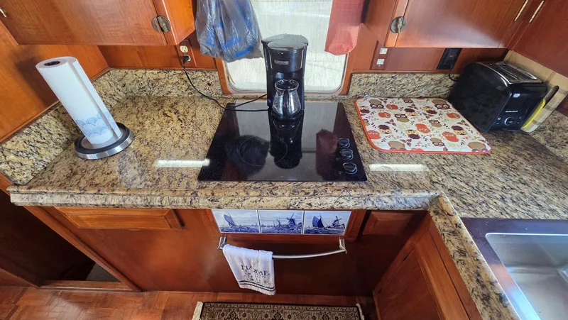 Slide: The Image of Kitchen area of 1987 DeFever 48 Tri Cabin yacht. - 49