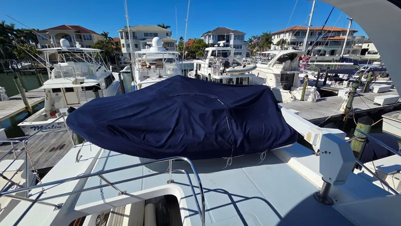 Slide: The Image of 1987 DeFever 48 Tri Cabin yacht covered in marina. - 7