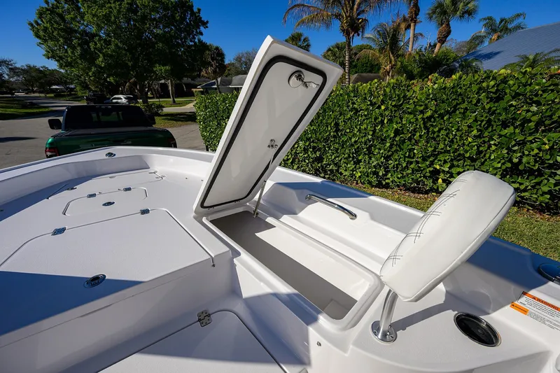 Slide: The Image of 2023 Sportsman Masters 267 Bay Boat with open storage compartment and seating. - 13