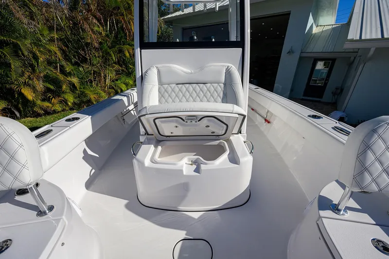 Slide: The Image of 2023 Sportsman Masters 267 Bay Boat interior with open storage compartment. - 15