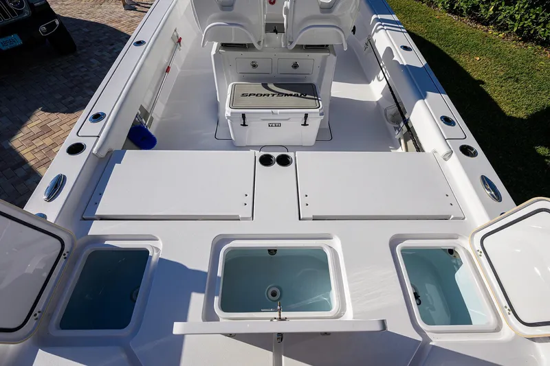 Slide: The Image of 2023 Sportsman Masters 267 Bay Boat interior with seating and storage compartments. - 27