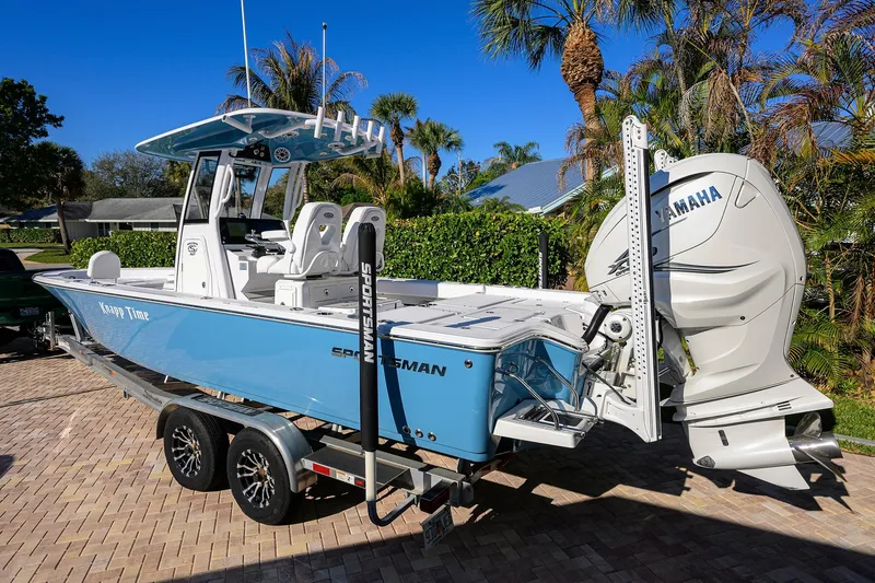 Slide: The Image of 2023 Sportsman Masters 267 Bay Boat with Yamaha engine, parked on a sunny driveway. - 44