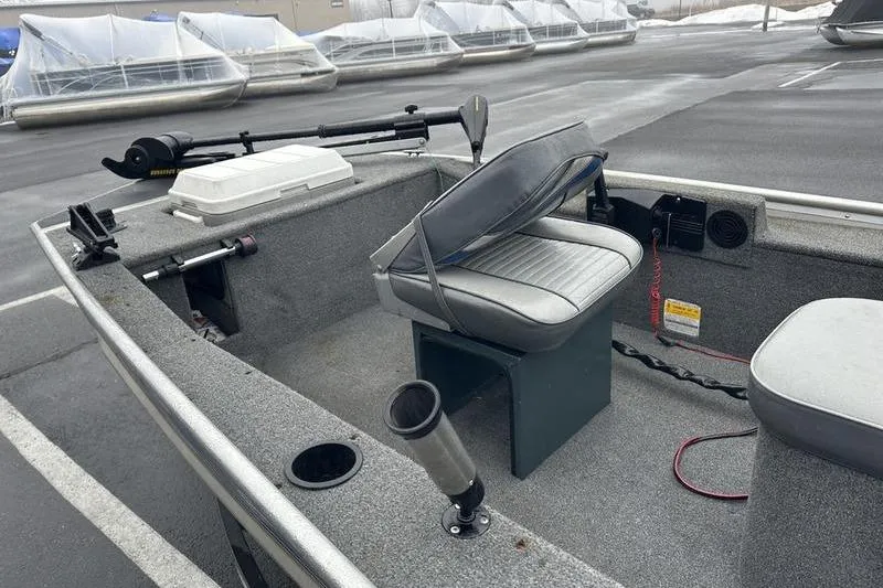 Slide: The Image of 1992 Tracker Panfish 16 boat interior with seating and fishing equipment. - 5