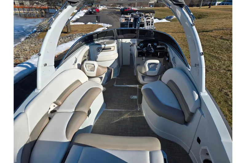 Slide: The Image of 2018 Crownline 275 SS boat interior with spacious seating and modern dashboard. - 10