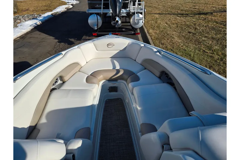 Slide: The Image of 2018 Crownline 275 SS boat interior with plush seating and sleek design. - 19