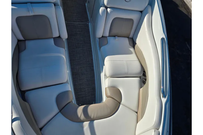 Slide: The Image of 2018 Crownline 275 SS boat interior with beige and white seating. - 21