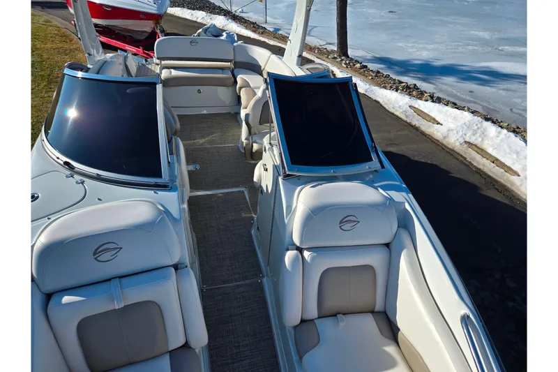 Slide: The Image of 2018 Crownline 275 SS boat interior with plush seating and sleek design. - 22
