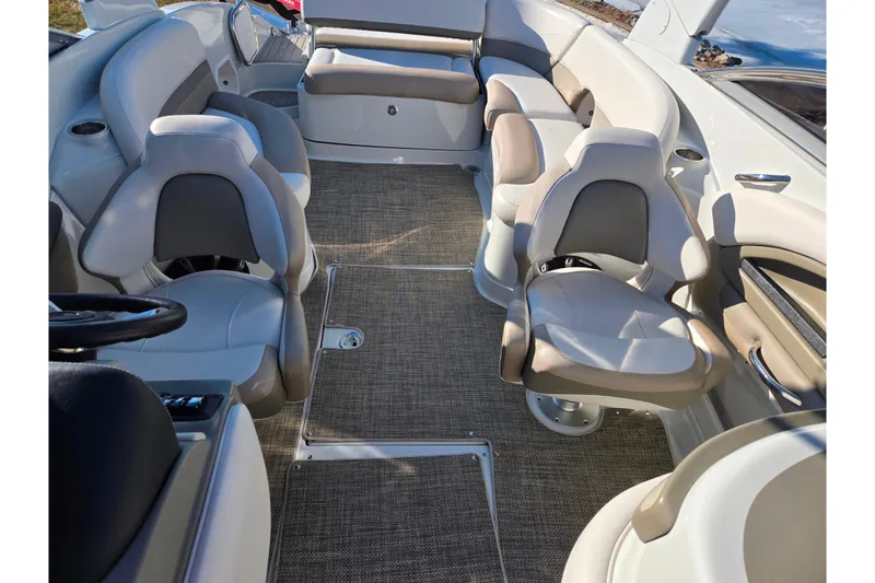 Slide: The Image of 2018 Crownline 275 SS boat interior with plush seating and modern design. - 23