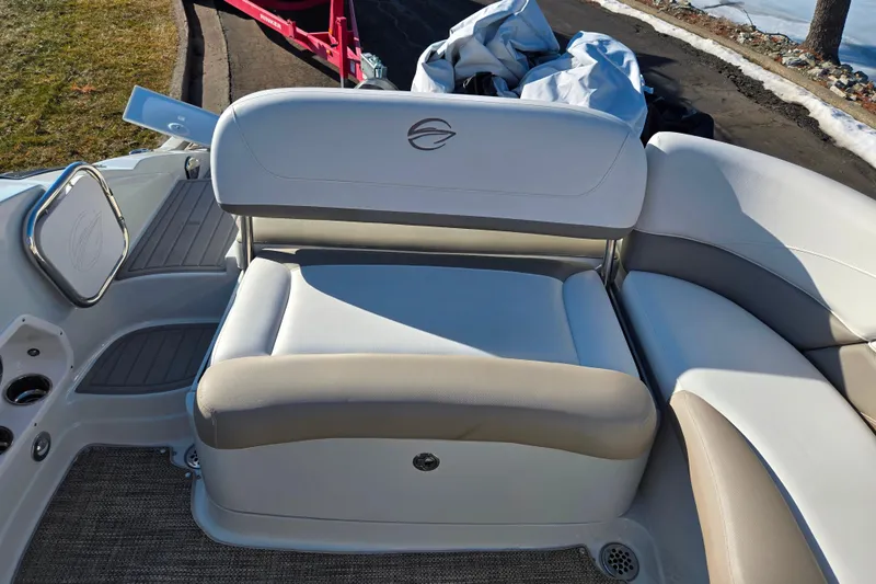 Slide: The Image of 2018 Crownline 275 SS boat interior with cushioned seating and sleek design. - 25