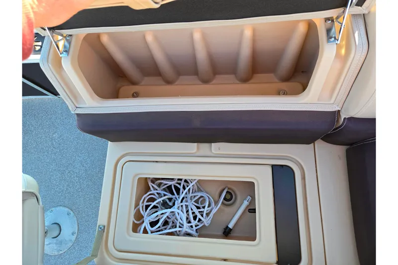 Slide: The Image of 2018 Sun Tracker Bass Buggy 18 DLX storage compartments with rope and accessories. - 16