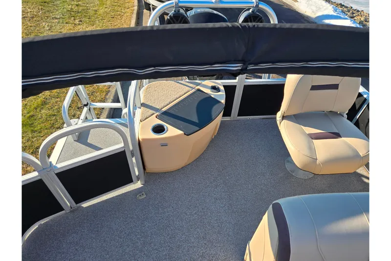 Slide: The Image of 2018 Sun Tracker Bass Buggy 18 DLX interior with seating and storage. - 20