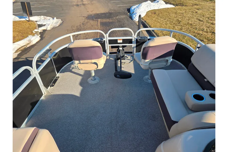 Slide: The Image of 2018 Sun Tracker Bass Buggy 18 DLX pontoon boat interior with seating and steering console. - 27