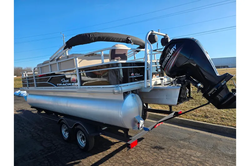 Slide: The Image of 2018 Sun Tracker Bass Buggy 18 DLX pontoon boat on trailer with Mercury outboard motor. - 3