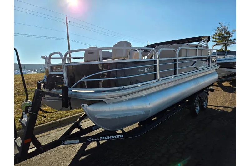 Slide: The Image of 2018 Sun Tracker Bass Buggy 18 DLX pontoon boat on trailer, sunny day. - 7