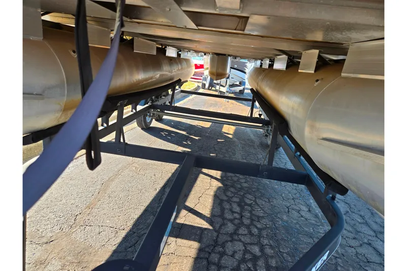 Slide: The Image of Underneath view of a 2018 Sun Tracker Bass Buggy 18 DLX pontoon boat on a trailer. - 9