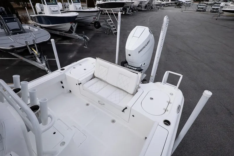 Slide: The Image of 2026 Blazer Bay Makaira 2800 boat with Mercury engine, docked in a marina. - 12