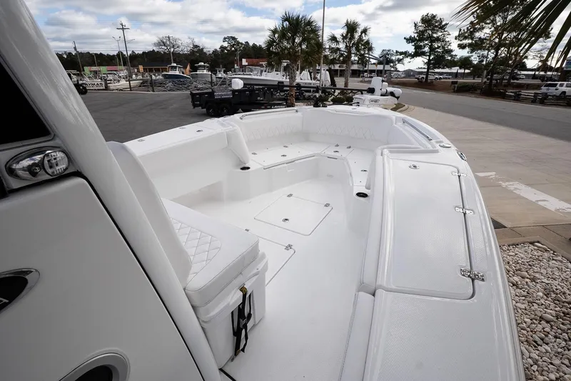 Slide: The Image of 2026 Blazer Bay Makaira 2800 boat interior with spacious seating and storage compartments. - 16