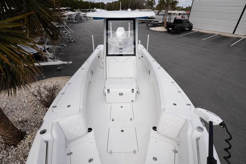 Slide: The Image of 2026 Blazer Bay Makaira 2800 boat, spacious deck view, parked outdoors. - 19