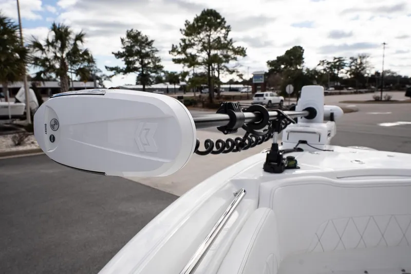 Slide: The Image of 2026 Blazer Bay Makaira 2800 boat with advanced trolling motor in a parking area. - 21