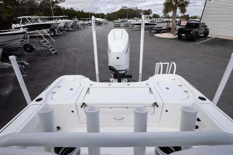 Slide: The Image of 2026 Blazer Bay Makaira 2800 boat at dealership, showcasing deck and motor. - 28