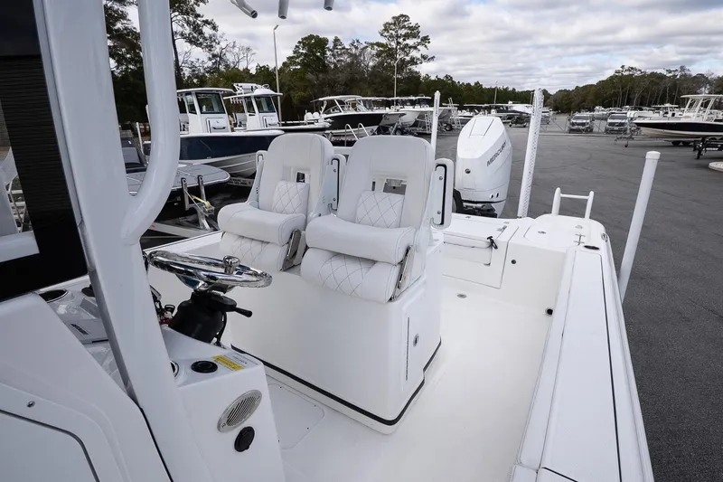 Slide: The Image of 2026 Blazer Bay Makaira 2800 boat interior with dual seats and steering wheel. - 31