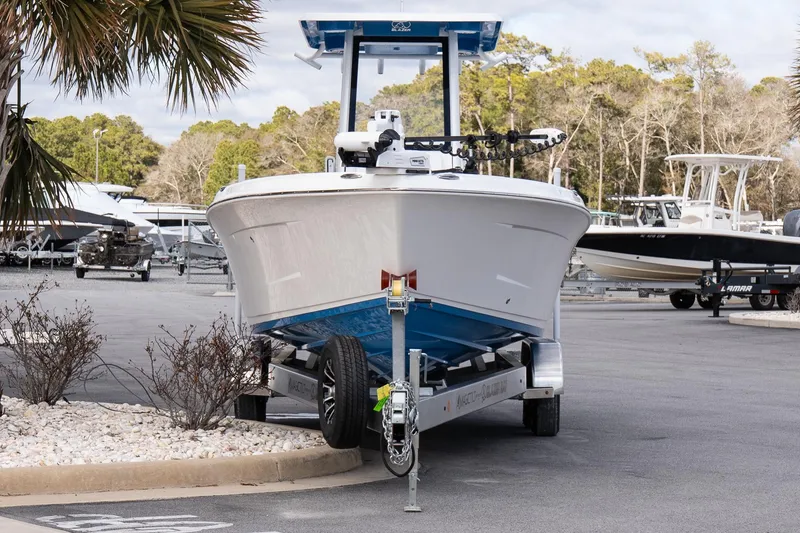 Slide: The Image of 2026 Blazer Bay Makaira 2800 boat on trailer in marina setting. - 4
