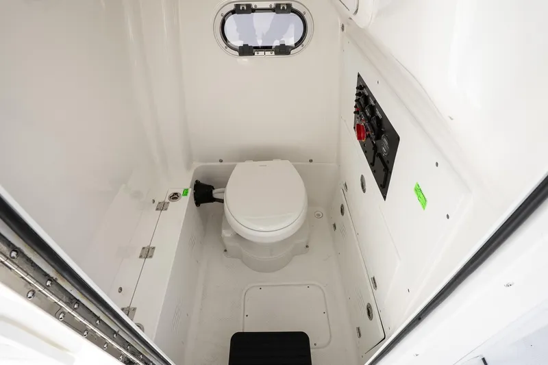 Slide: The Image of 2026 Blazer Bay Makaira 2800 boat interior bathroom with toilet and control panel. - 41