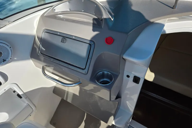 Slide: The Image of 2007 Rinker 262 Captiva Cuddy boat interior with speaker and storage compartment. - 14