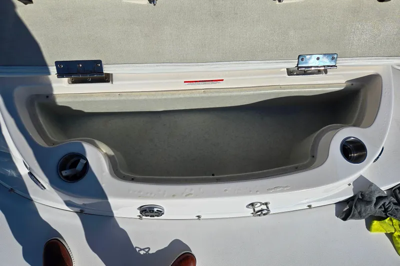 Slide: The Image of Open storage compartment on a 2007 Rinker 262 Captiva Cuddy boat. - 28