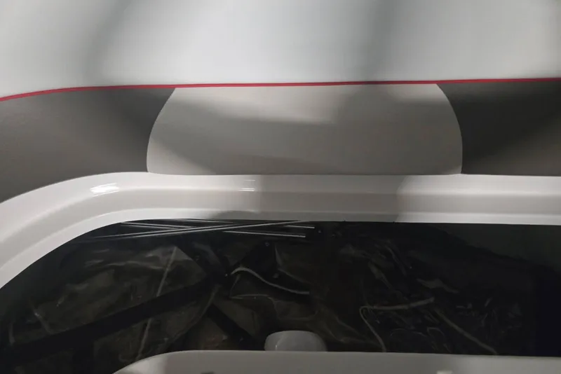 Slide: The Image of Interior view of a 2007 Rinker 262 Captiva Cuddy boat, featuring sleek design elements. - 32