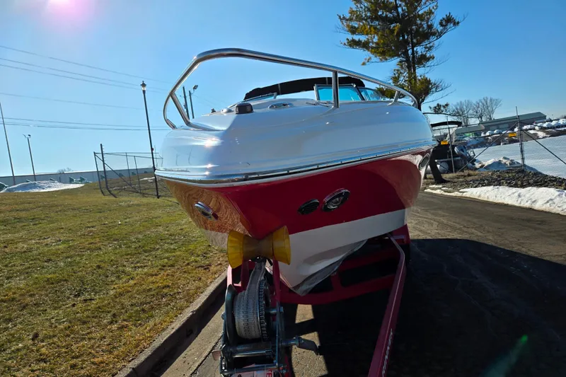 Slide: The Image of 2007 Rinker 262 Captiva Cuddy boat on trailer, sunny day, grassy area. - 6