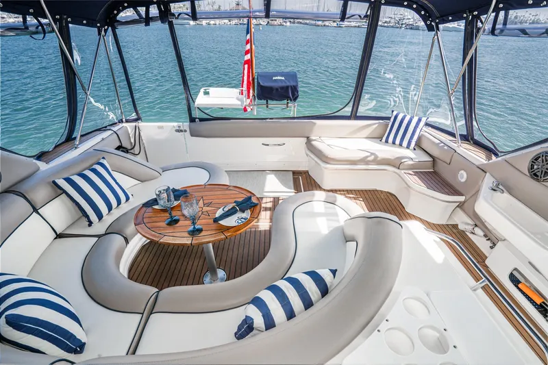 Slide: The Image of Luxurious 1999 Sea Ray 500 Sundancer yacht interior with elegant seating and nautical decor. - 13