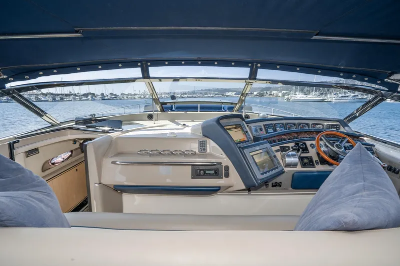 Slide: The Image of Cockpit view of 1999 Sea Ray 500 Sundancer yacht with advanced navigation controls. - 14