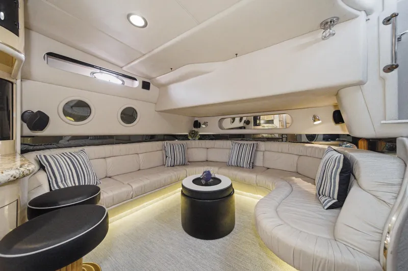 Slide: The Image of Luxurious interior of a 1999 Sea Ray 500 Sundancer yacht with plush seating and modern decor. - 17