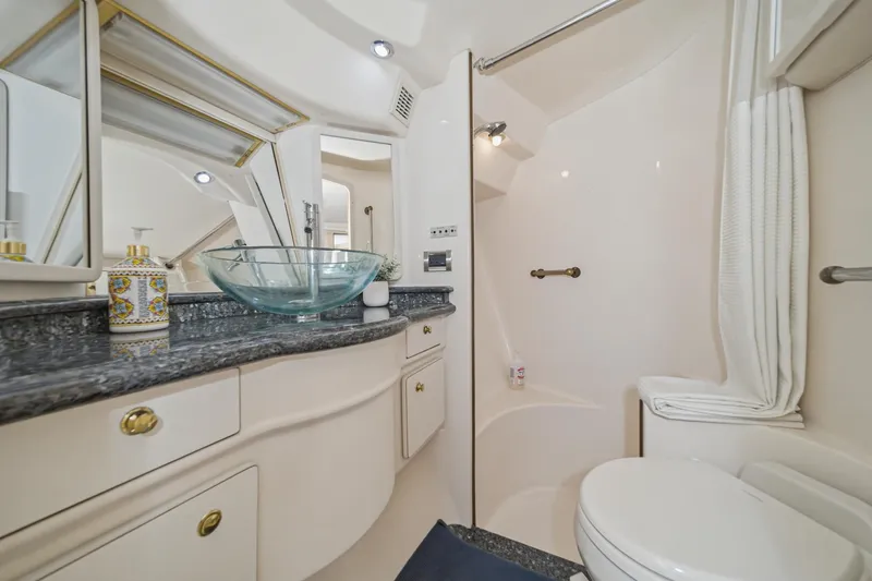 Slide: The Image of Luxurious bathroom in 1999 Sea Ray 500 Sundancer yacht with modern fixtures. - 19