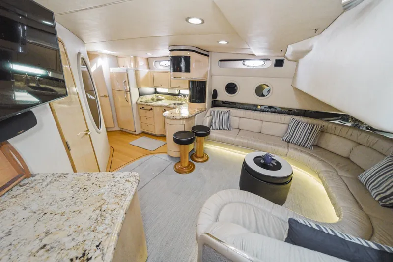 Slide: The Image of Luxurious interior of a 1999 Sea Ray 500 Sundancer yacht with modern amenities. - 21
