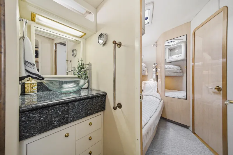 Slide: The Image of Luxurious 1999 Sea Ray 500 Sundancer yacht interior with elegant bathroom and cozy bedroom. - 27