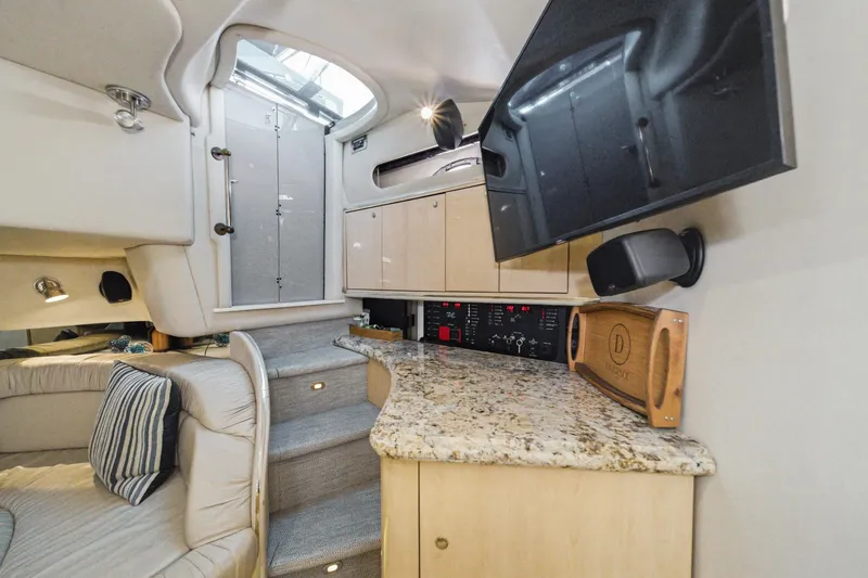 Slide: The Image of Interior of 1999 Sea Ray 500 Sundancer yacht with modern amenities and elegant design. - 28