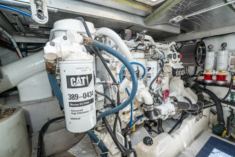 Slide: The Image of Engine room of a 1999 Sea Ray 500 Sundancer with CAT marine oil filters. - 34