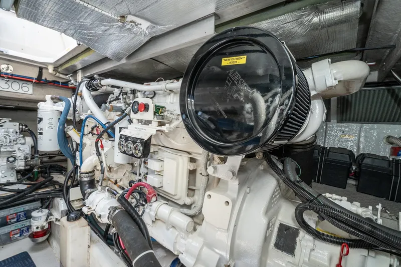Slide: The Image of Engine room of a 1999 Sea Ray 500 Sundancer yacht, showcasing mechanical components. - 37