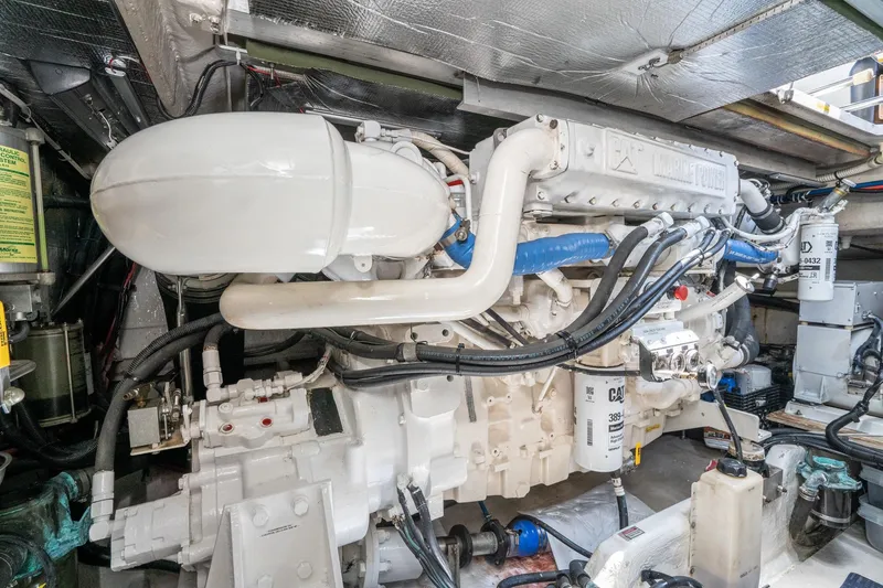 Slide: The Image of Engine room of a 1999 Sea Ray 500 Sundancer with visible marine engine components. - 42