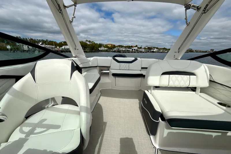 Slide: The Image of 2021 Regal 23 OBX boat interior with luxurious seating and open water view. - 9