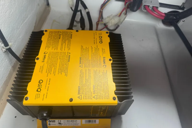 Slide: The Image of Yellow Delta-Q QuiQ battery charger in a 2016 Duffy D-22 Bay Island boat. - 8
