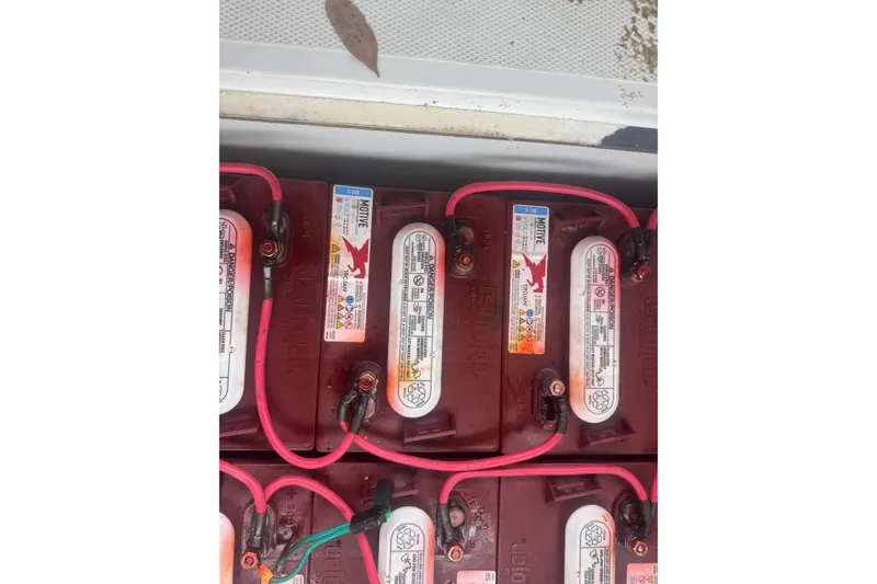 Slide: The Image of Batteries in a 2016 Duffy D-22 Bay Island boat with red cables. - 11