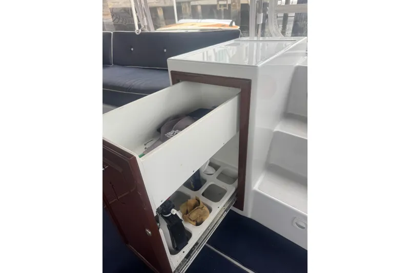 Slide: The Image of Interior of 2016 Duffy D-22 Bay Island boat with open storage drawer. - 5