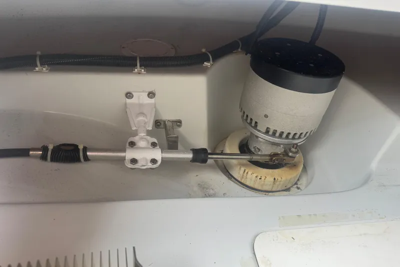 Slide: The Image of 2016 Duffy D-22 Bay Island boat steering mechanism and motor detail. - 9