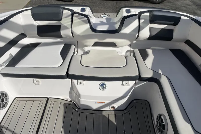 Slide: The Image of 2022 Yamaha Boats 195S interior seating with sleek design and comfortable cushions. - 7